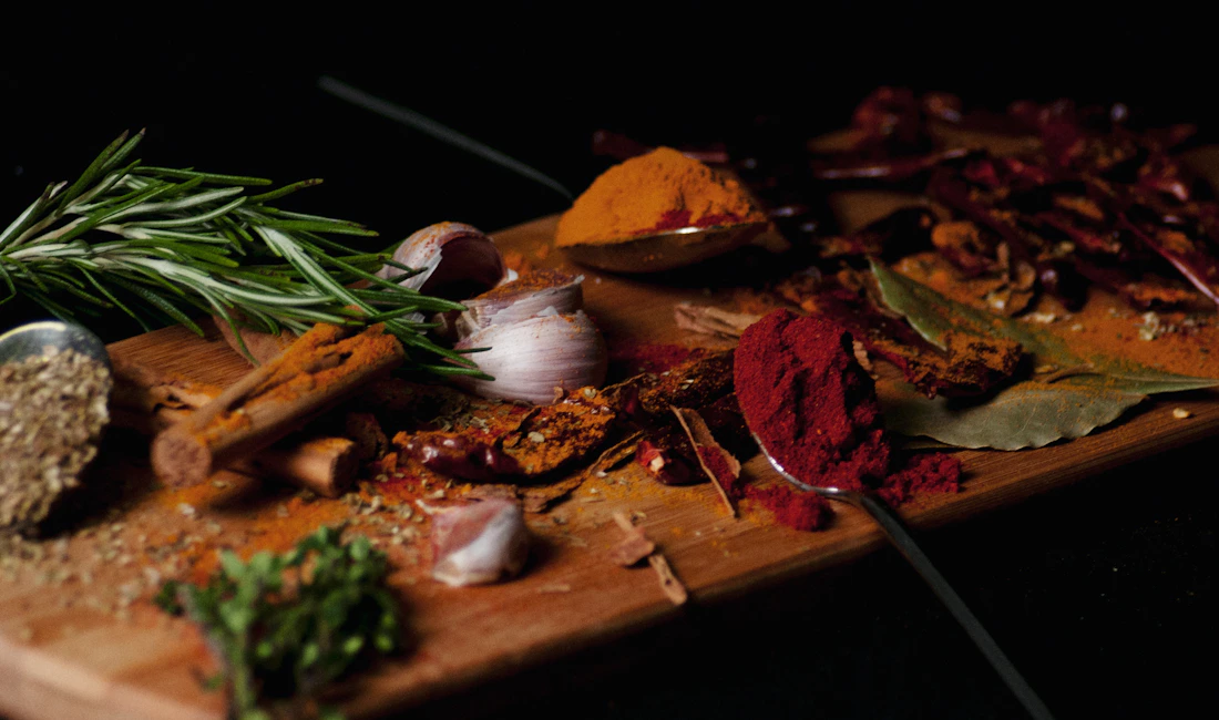 Colorful spices with garlic and fresh herbs
